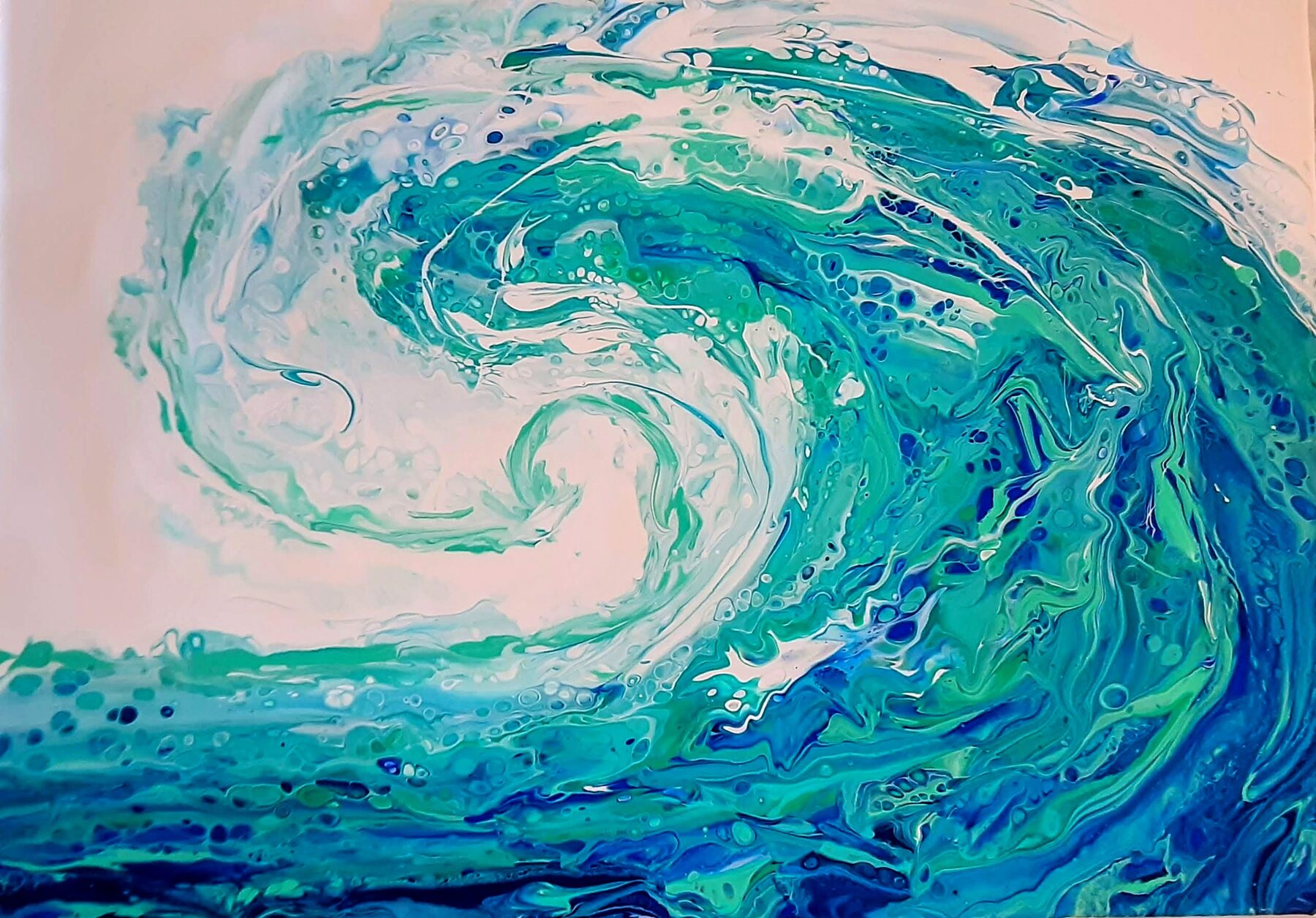 Teal and white acrylic pour of a breaking wave curling on a pale pink ground